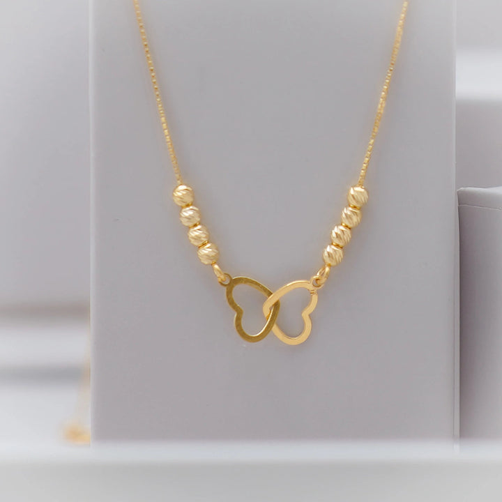 Tassya Golden Interlocked Heart Pendant – Romantic gold-plated 925 silver chain with dual heart design, ideal for gifting.