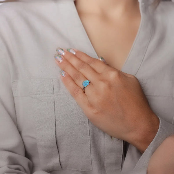 Tassya Blue Peacock Charm Ring – Vibrant 925 silver ring with peacock-inspired blue enamel, perfect for festive flair.