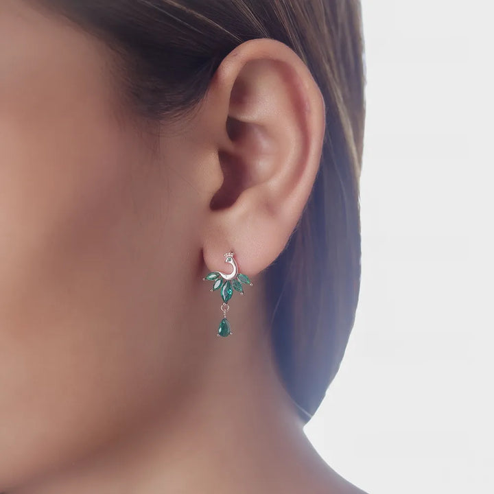 Tassya Green Emerald Peacock Earrings – Ornate 925 silver earrings with peacock motif and green stones, ideal for festive wear