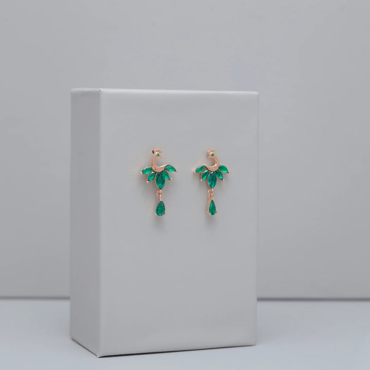 Tassya Green Emerald Peacock Earrings – Ornate 925 silver earrings with peacock motif and green stones, ideal for festive wear